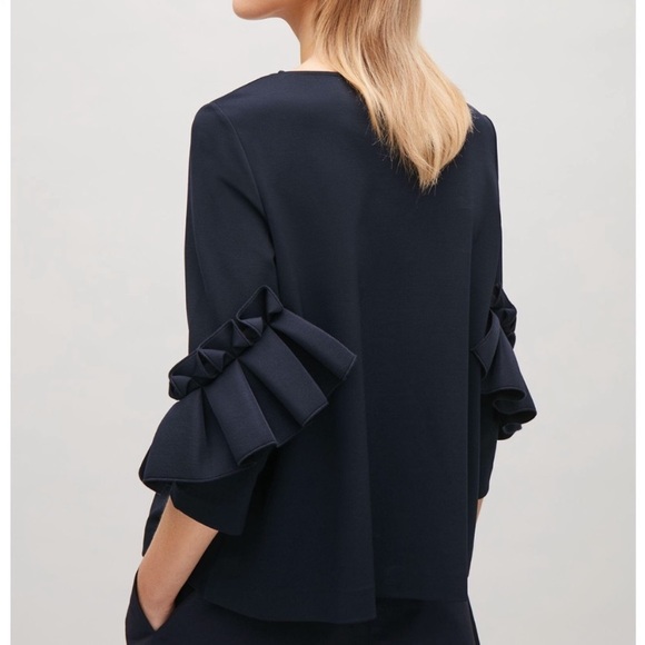 COS Tops - NWOT COS gorgeous black stretchy thick blouse with stunning sleeves.